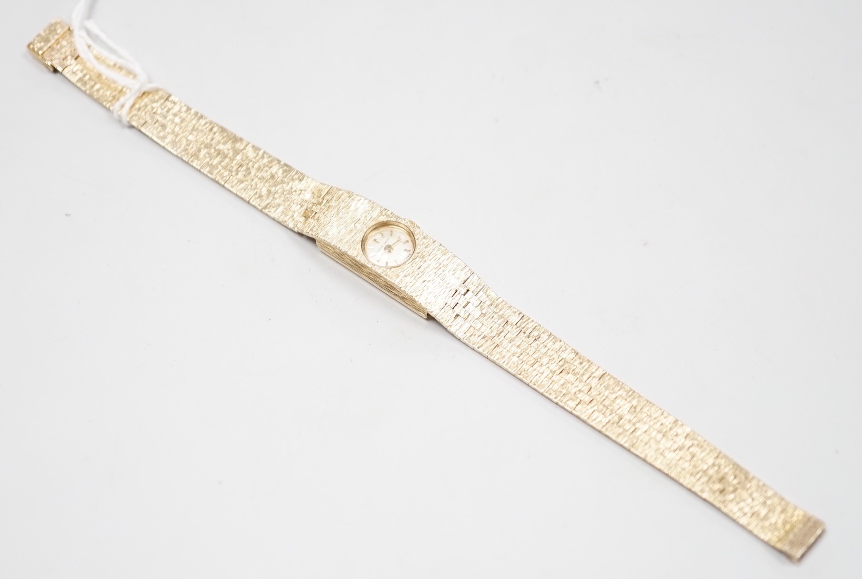 A lady's 9ct gold Buech Girod manual wind bracelet watch, 16.3cm, gross weight 25.3 grams